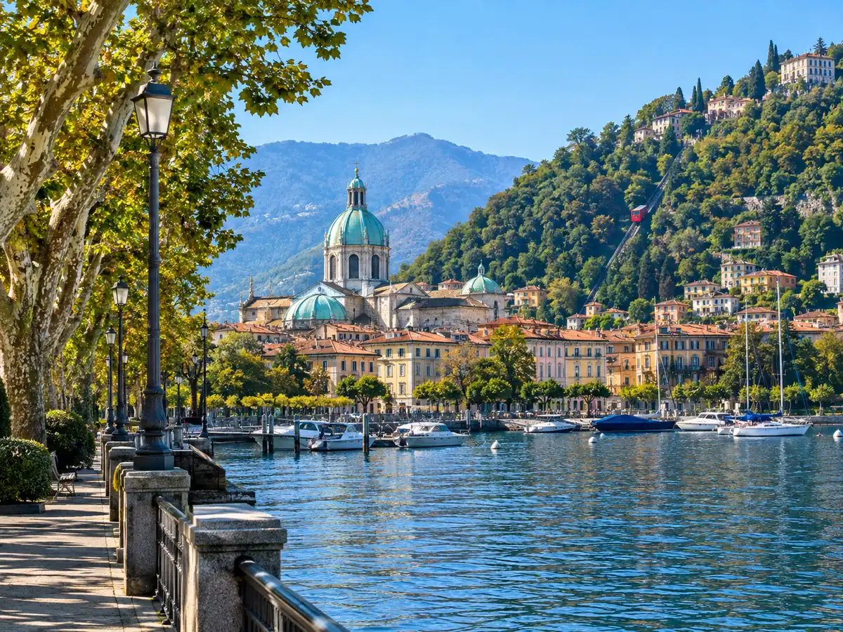 Como lakefront promenade with the cathedral dome and the Brunate funicular